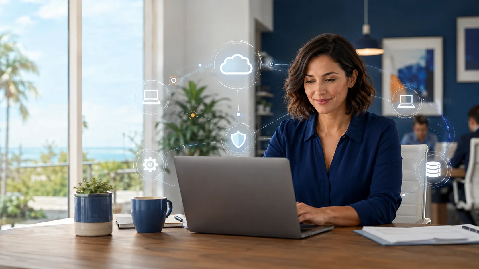 IT professional working at a laptop in an office